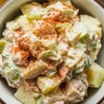 A serving of Hellmann's Potato Salad Recipe in a bowl, garnished with paprika